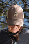 Women wearing brown ball cap with tan mesh, OBSC Logo on front,