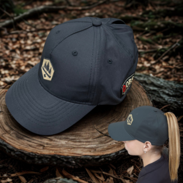 An all Black hat with OBSC Logo, Pony tail hole image of girl wearing hat.
